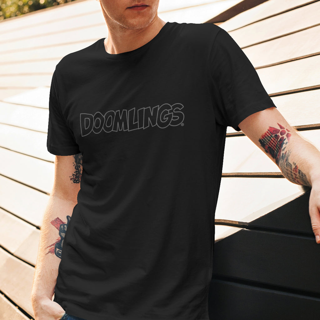 man wearing black doomlings tshirt with grey logo