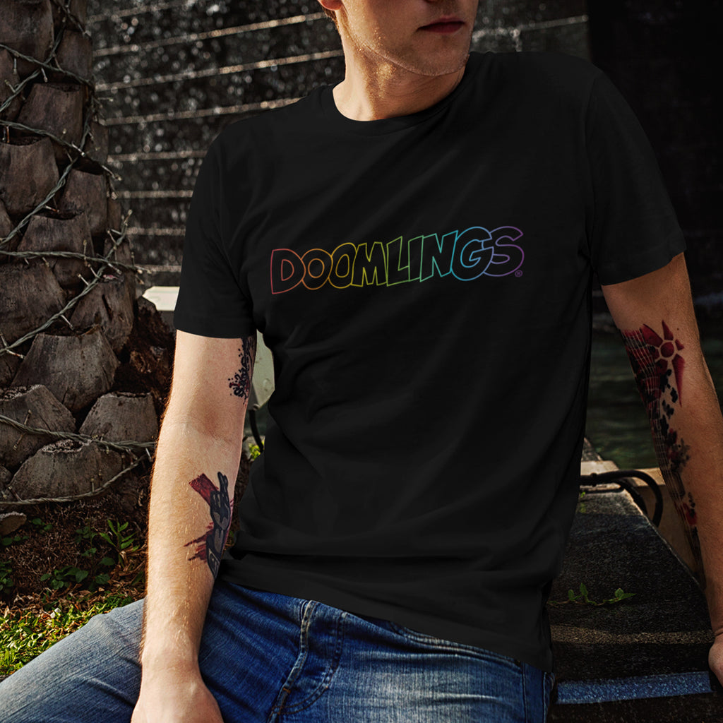 man wearing a rainbow doomlings logo on a black tshirt