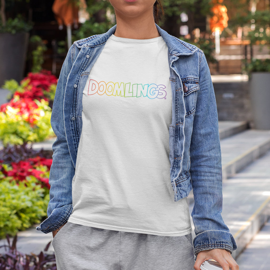 woman wearing a rainbow doomlings logo on a white tshirt