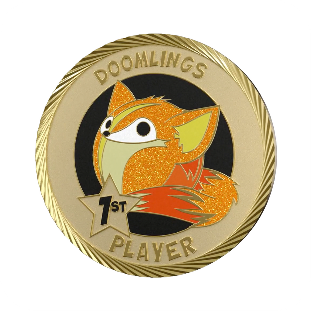 elusive doomlings first player medallion coin, gold coin that says doomlings 1st player with cute art of a fox on it